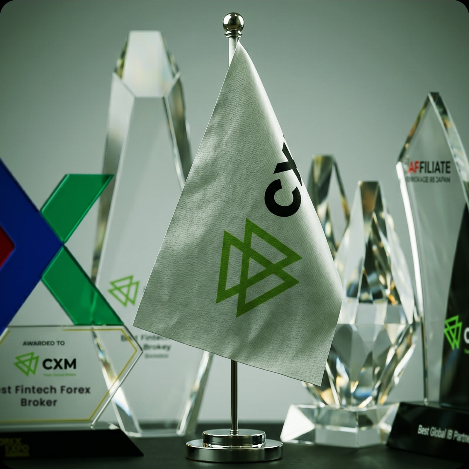 CXM industry award trophies on display